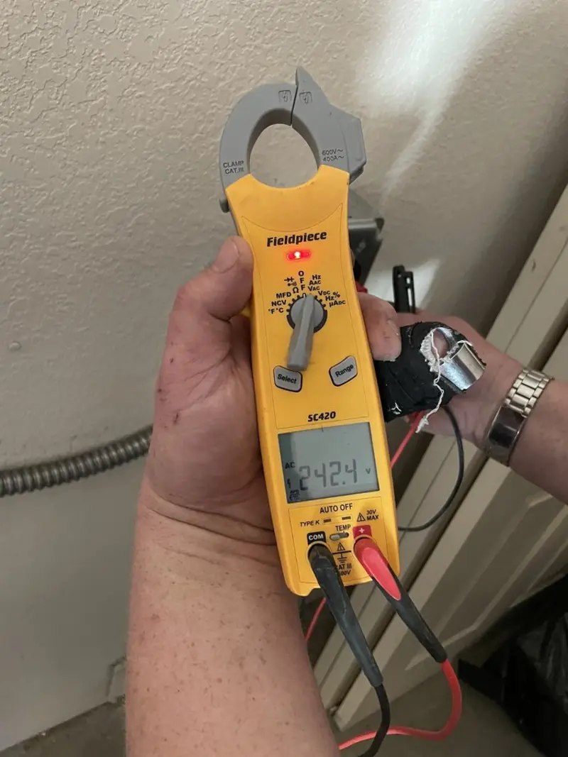 Voltage testing with clamp meter during Electrical Installation Services in Baldwinsville